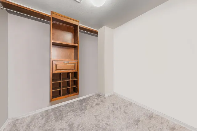 a view of a hallway with bathroom