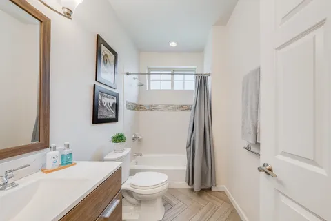 a bed room with a bed and a television