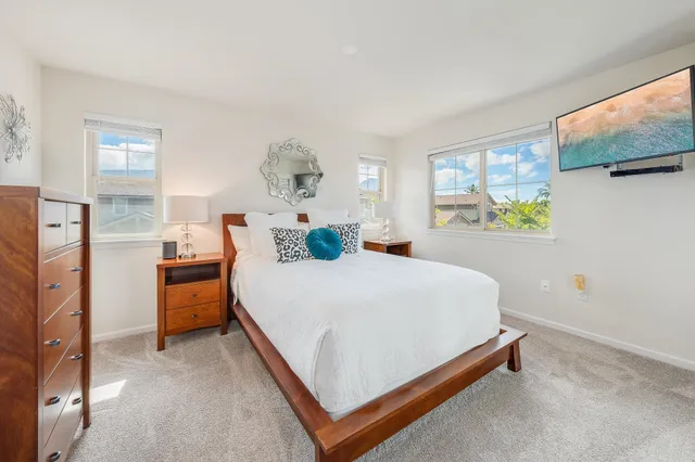 a bedroom with a bed and a dresser