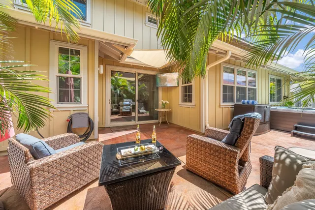 a outdoor living area with furniture and a potted plant