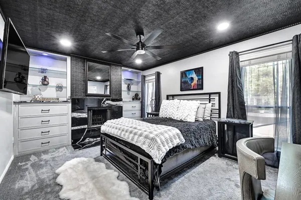 a bedroom with a bed and furniture
