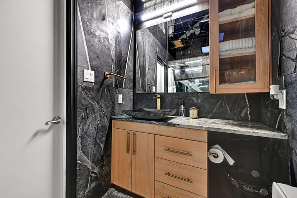 a bathroom with a sink and a mirror