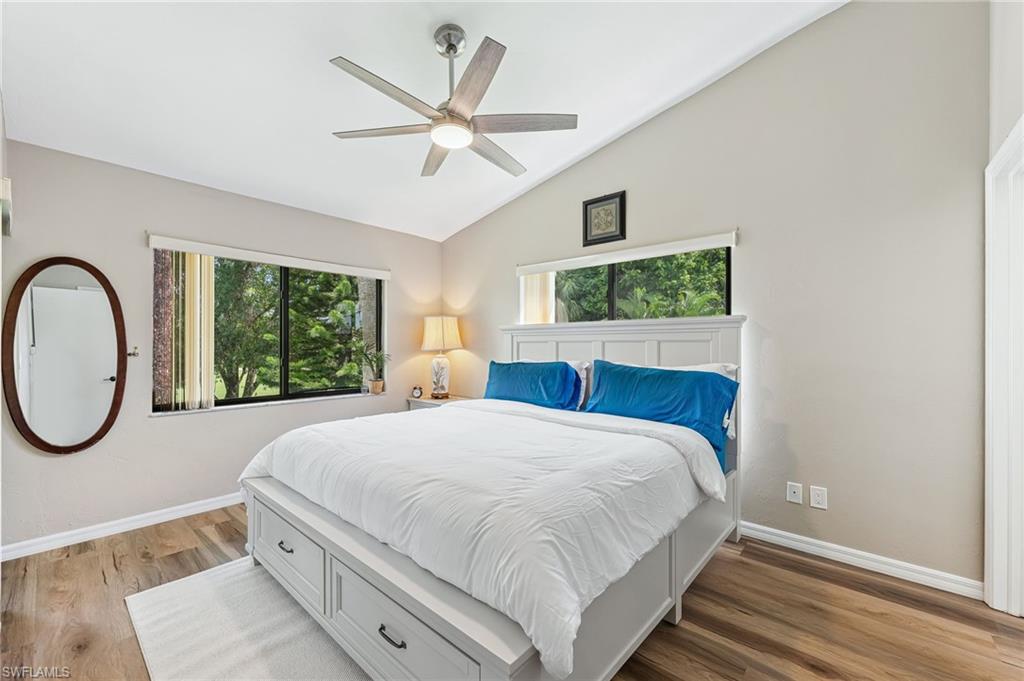 5857 Rattlesnake Hammock Road, Unit 208 Naples, FL 34113 - Photo 13 of 24 a bedroom with a large bed and a window