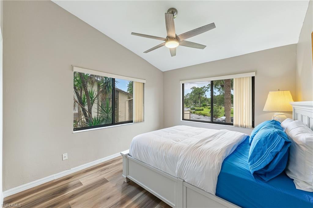 5857 Rattlesnake Hammock Road, Unit 208 Naples, FL 34113 - Photo 17 of 24 a bedroom with a bed and a window