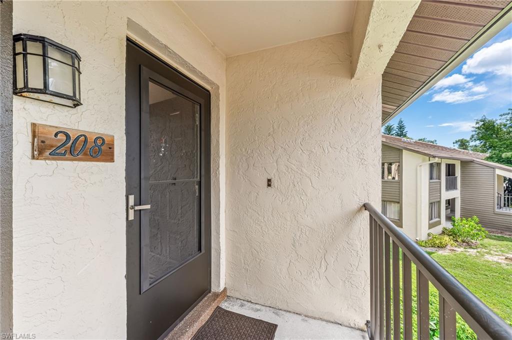 5857 Rattlesnake Hammock Road, Unit 208 Naples, FL 34113 - Photo 3 of 24 a view of front door