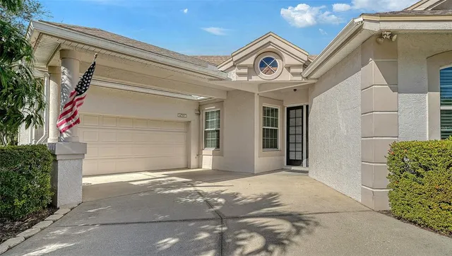 a front view of house with yard and green space