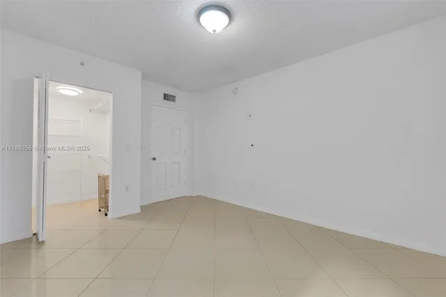 an empty room with white walls