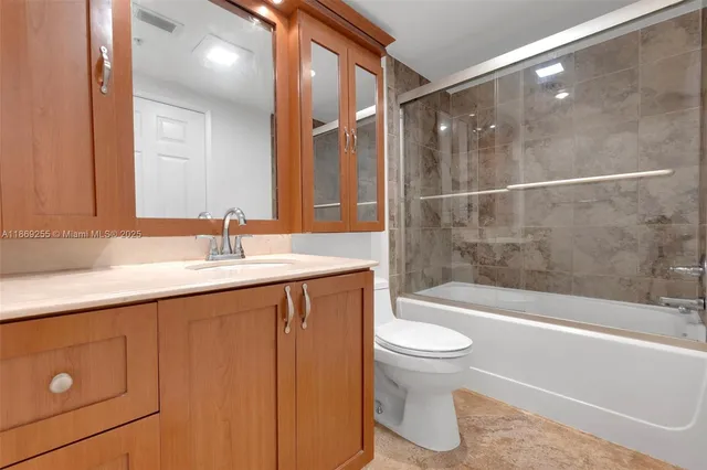 a bathroom with a sink a toilet and a bathtub
