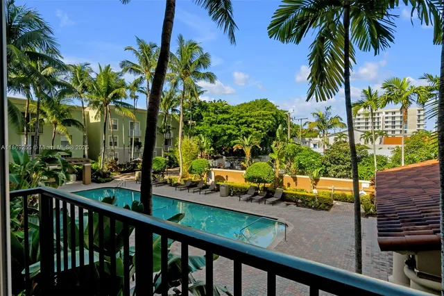 a view of a lake with a palm tree