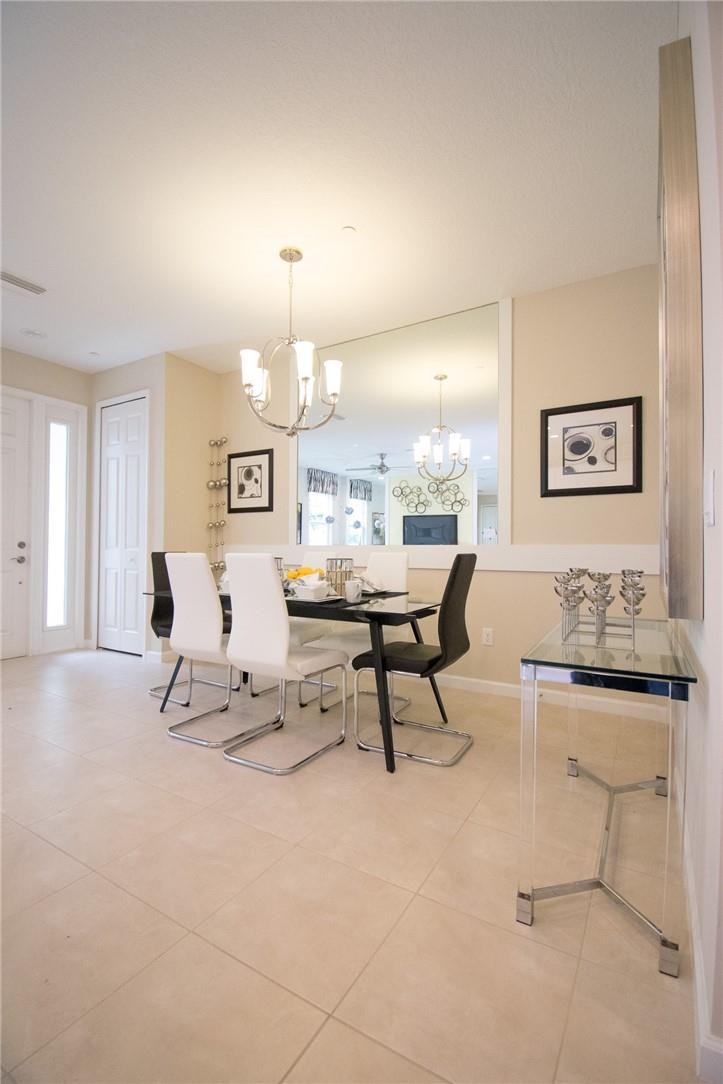 14377 Sims Road, Unit 9 Delray Beach, FL 33484 - Photo 3 of 8 a living room with furniture and a table