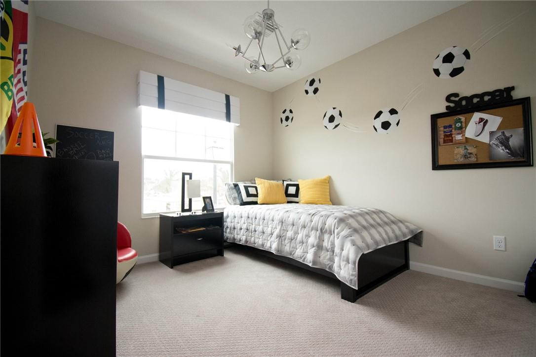 14377 Sims Road, Unit 9 Delray Beach, FL 33484 - Photo 5 of 8 a spacious bedroom with a bed and a window