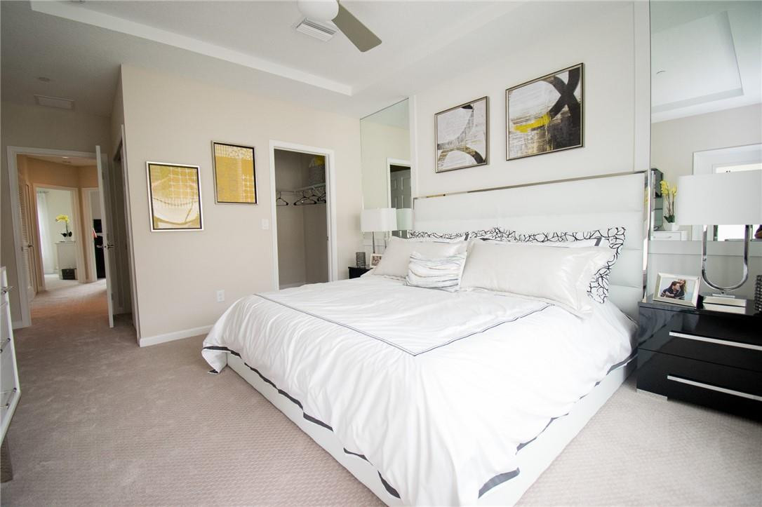 14377 Sims Road, Unit 9 Delray Beach, FL 33484 - Photo 6 of 8 a bedroom with bed and night stand