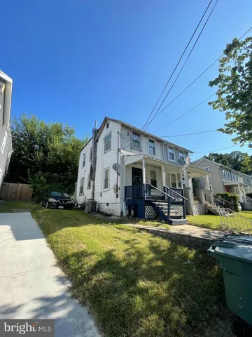 a view of a house with swimming pool and sitting area