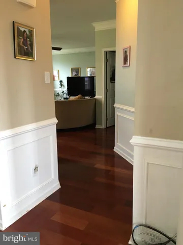 a view of living room with furniture and flat screen tv