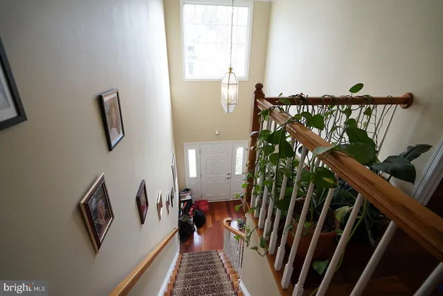 a view of an entryway with wooden floor