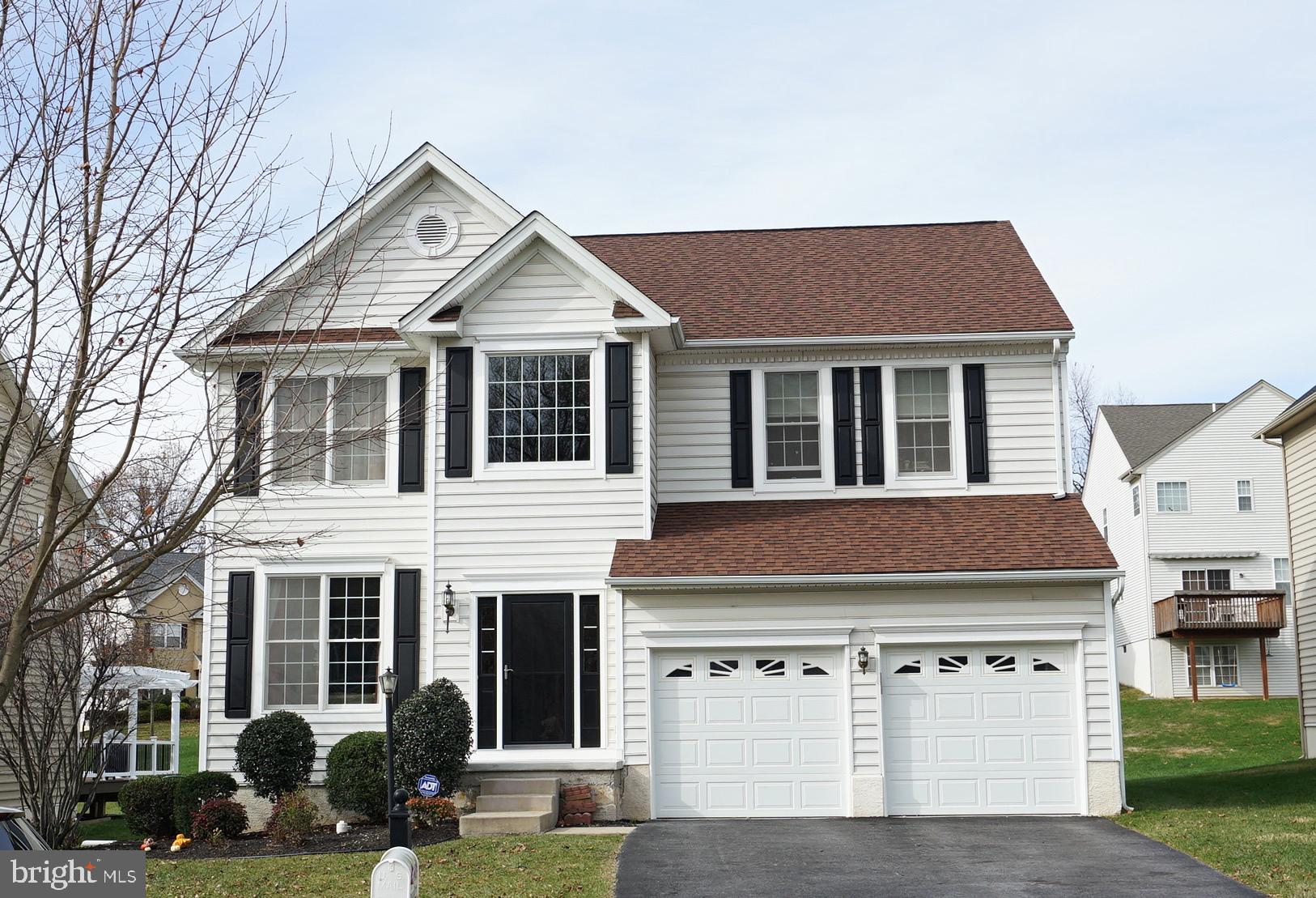 1203 Denton Drive Chester Springs, PA 19425 - Photo 2 of 31 a view of a white house with large windows and yard