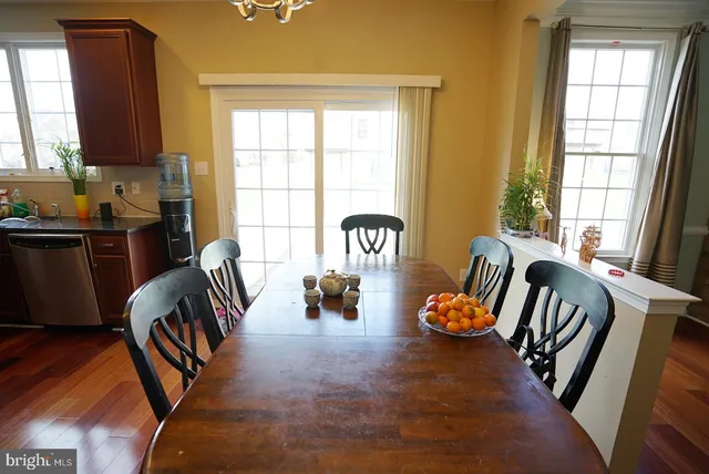 a bedroom with furniture and a large window
