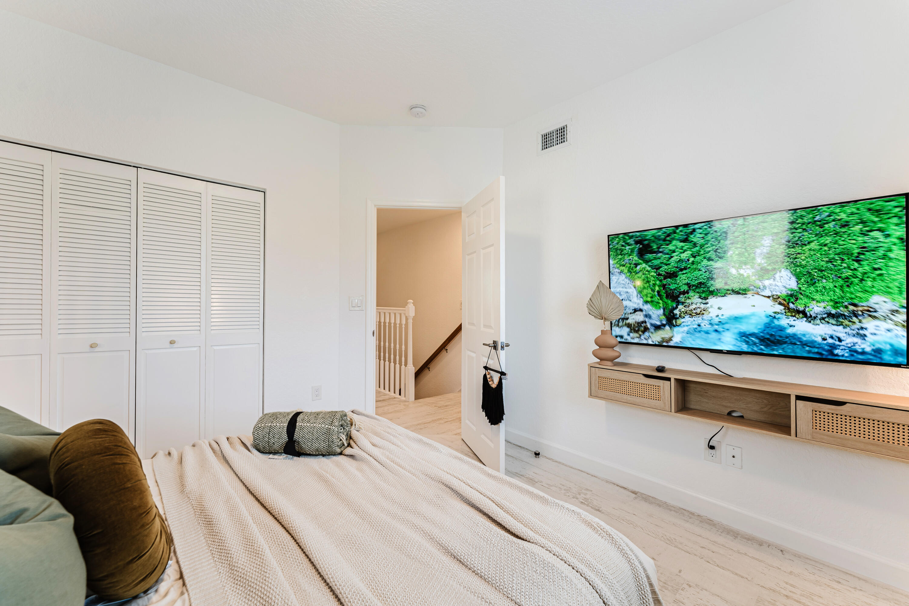 921 Ortega Road West Palm Beach, FL 33405 - Photo 19 of 60 a bedroom with a bed and a large window