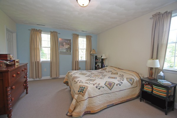 172 Scribner Road Tyngsborough, MA 01879 - Photo 11 of 17 a bedroom with a bed and a window