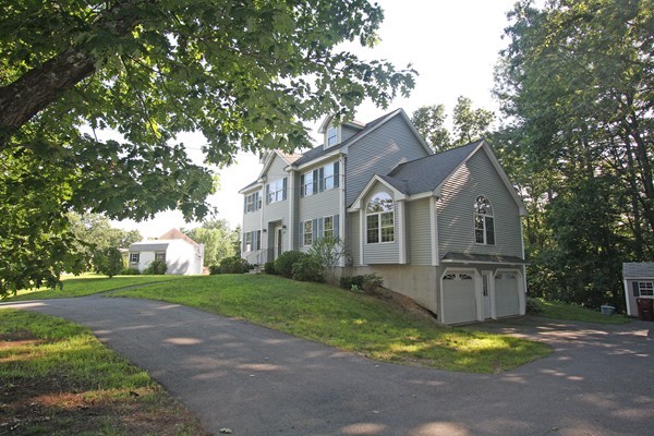 172 Scribner Road Tyngsborough, MA 01879 - Photo 2 of 17 a view of a yard in front of house