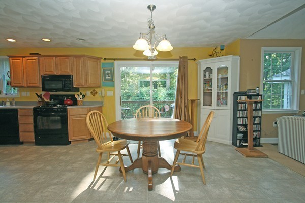 172 Scribner Road Tyngsborough, MA 01879 - Photo 4 of 17 a dining room with furniture a chandelier and window