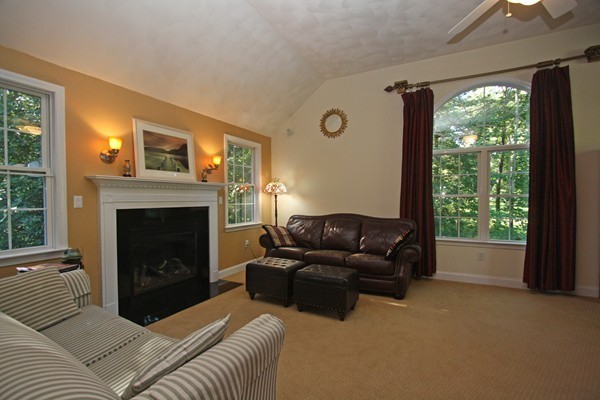 172 Scribner Road Tyngsborough, MA 01879 - Photo 6 of 17 a living room with furniture and a fireplace