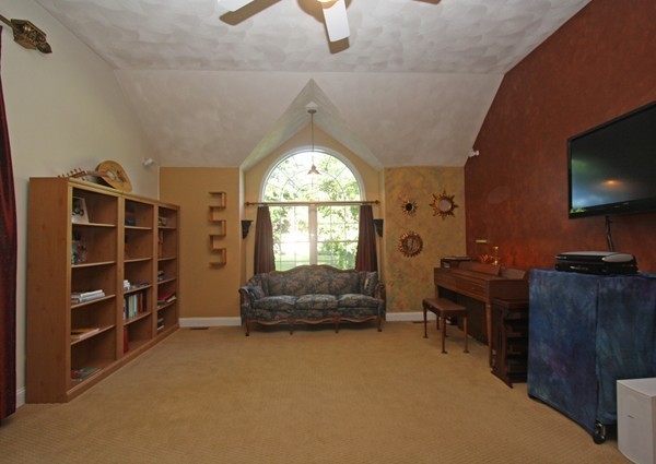 172 Scribner Road Tyngsborough, MA 01879 - Photo 8 of 17 a living room with furniture and a flat screen tv