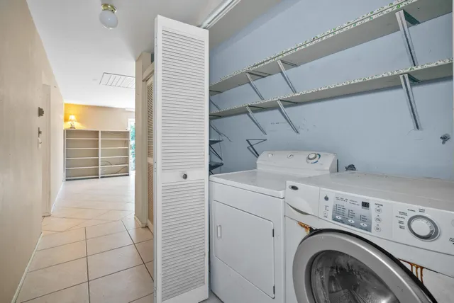 a view of storage and utility room with washer and dryer