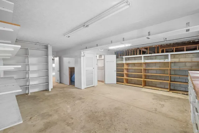 a view of an empty room with storage