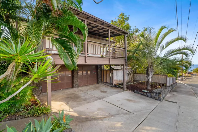 a view of a chairs and table in a patio