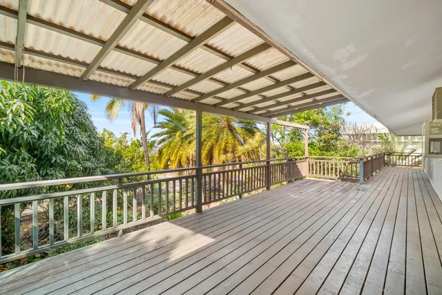 a view of balcony with wooden floor