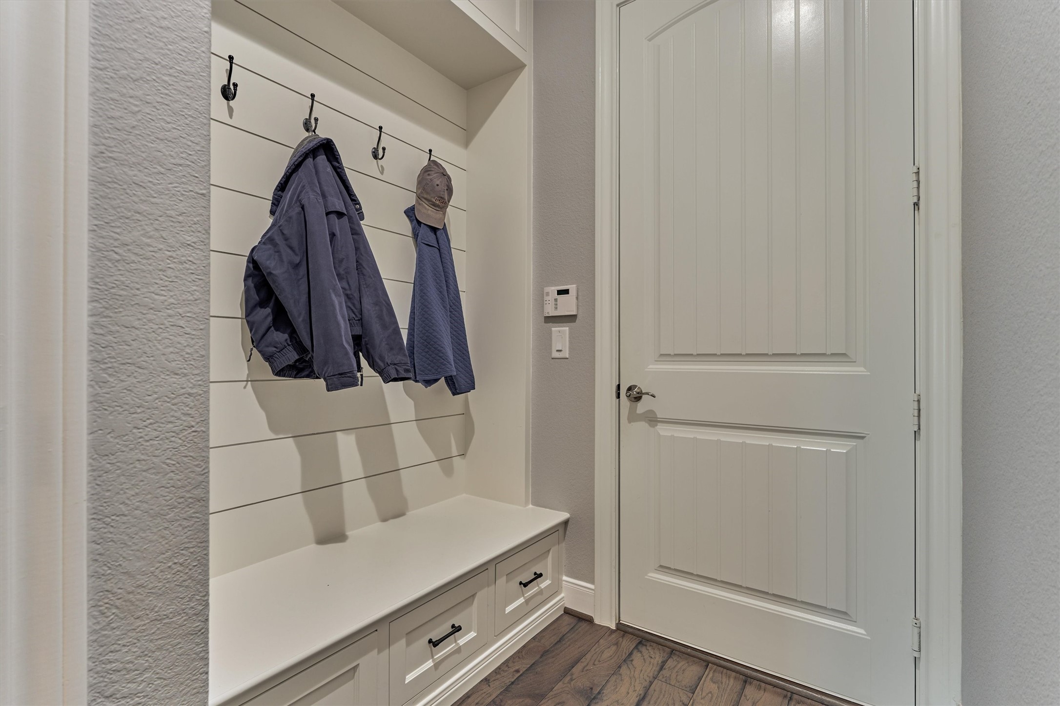 108 Wild Wick Way Spring, TX 77382 - Photo 34 of 44 Check Out This Recently Added Mud Space Off Of The Garage Entrance; This Mud Space Offers Upper Cabinets, Lower Drawers, Bench Seating, Four Hooks, And A Stylish Shiplap Backing.