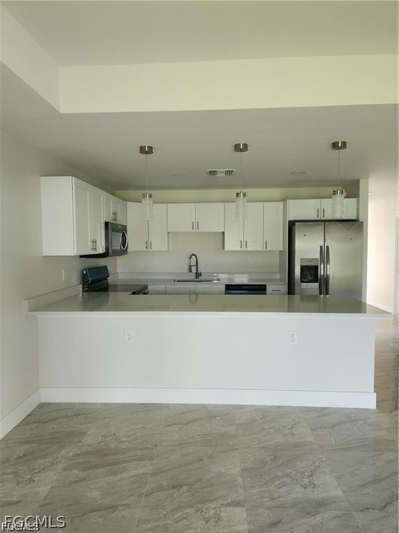 4540 20th Street Southwest Lehigh Acres, FL 33973 - Photo 4 of 5 a view of kitchen with wooden floor