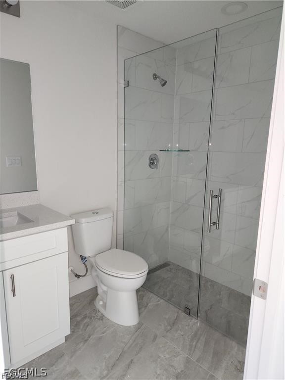 4540 20th Street Southwest Lehigh Acres, FL 33973 - Photo 5 of 5 a bathroom with a toilet sink and shower