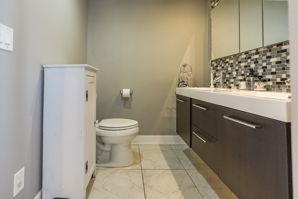 142 Norman Street Fall River, MA 02721 - Photo 11 of 25 a bathroom with a toilet and a sink