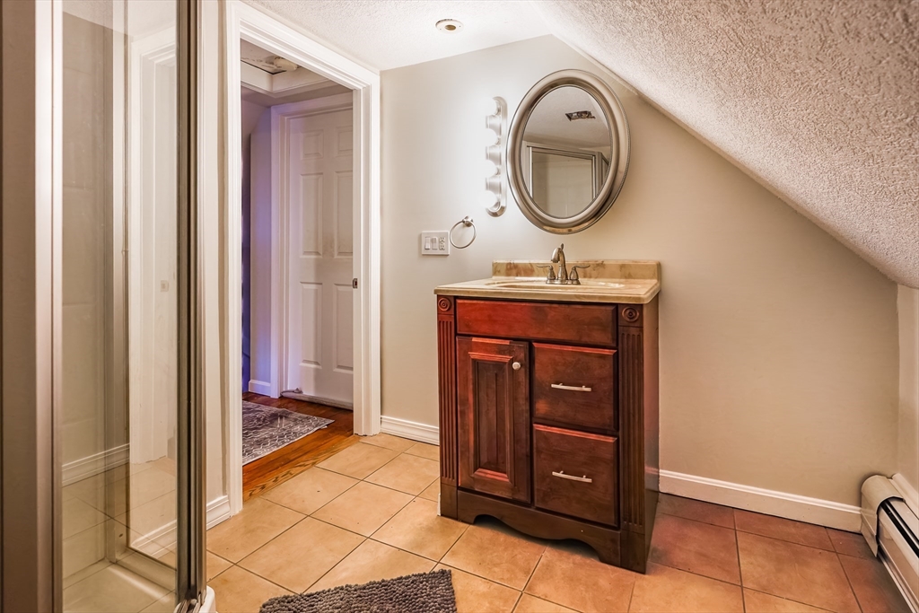 142 Norman Street Fall River, MA 02721 - Photo 18 of 25 a view of a hallway with entryway wooden floor and cabinet