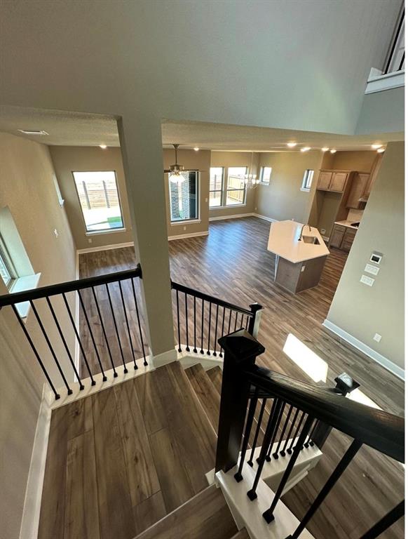 2525 Four Roses Drive Lewisville, TX 75056 - Photo 7 of 19 a view of a balcony with furniture and wooden floor