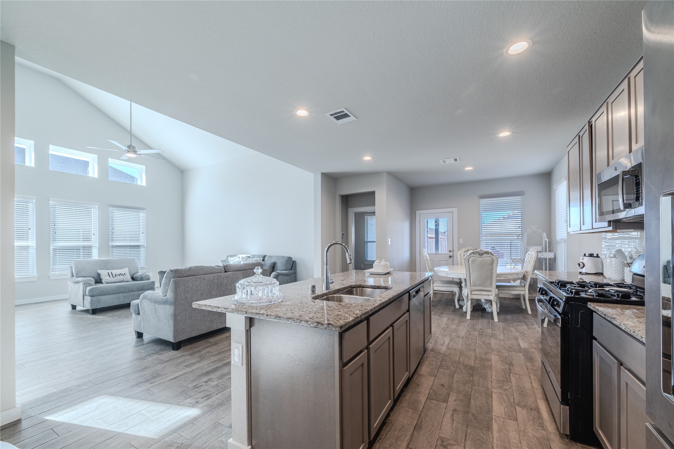 4259 Wyanngate Drive Spring, TX 77373 - Photo 13 of 46 This central viewpoint highlights the seamless transition between the kitchen, the sun-filled family room, and the cozy breakfast nook.