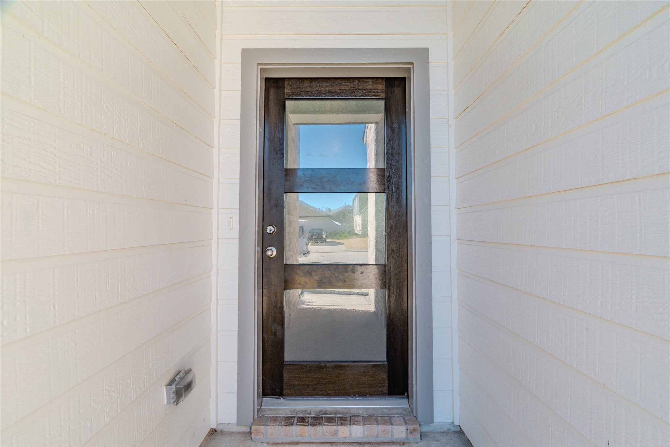 4259 Wyanngate Drive Spring, TX 77373 - Photo 2 of 46 Make a grand entrance through this contemporary glass-panel door, framed by a charming brick step and neutral siding