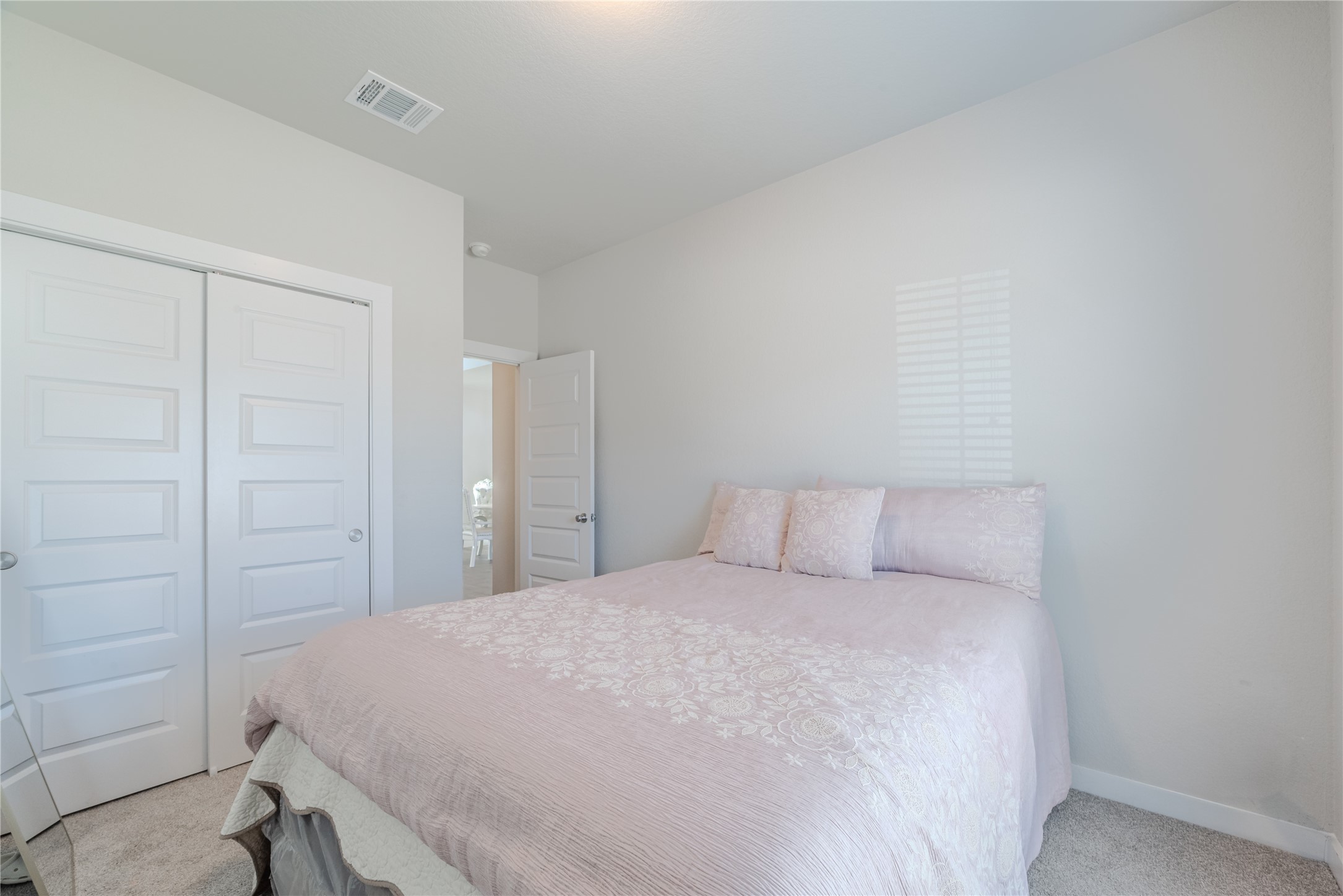4259 Wyanngate Drive Spring, TX 77373 - Photo 21 of 46 Comfortable first-floor bedroom featuring soft neutral tones and a large window for natural light