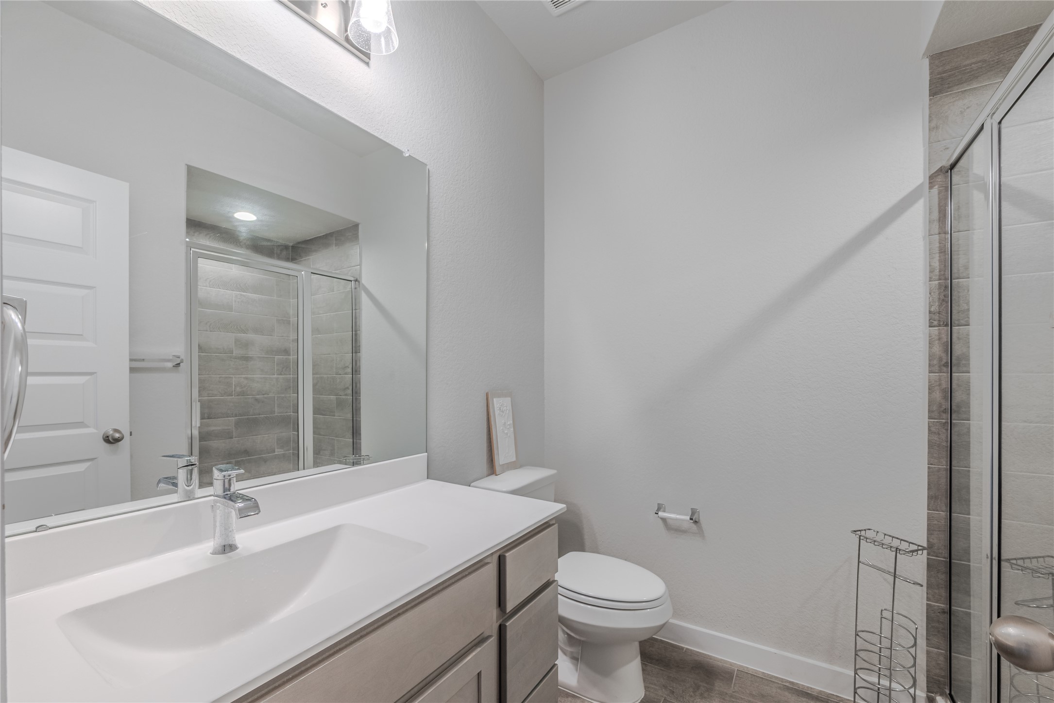 4259 Wyanngate Drive Spring, TX 77373 - Photo 23 of 46 Sleek full bathroom featuring a spacious walk-in shower with contemporary tile surround and a clean, modern vanity