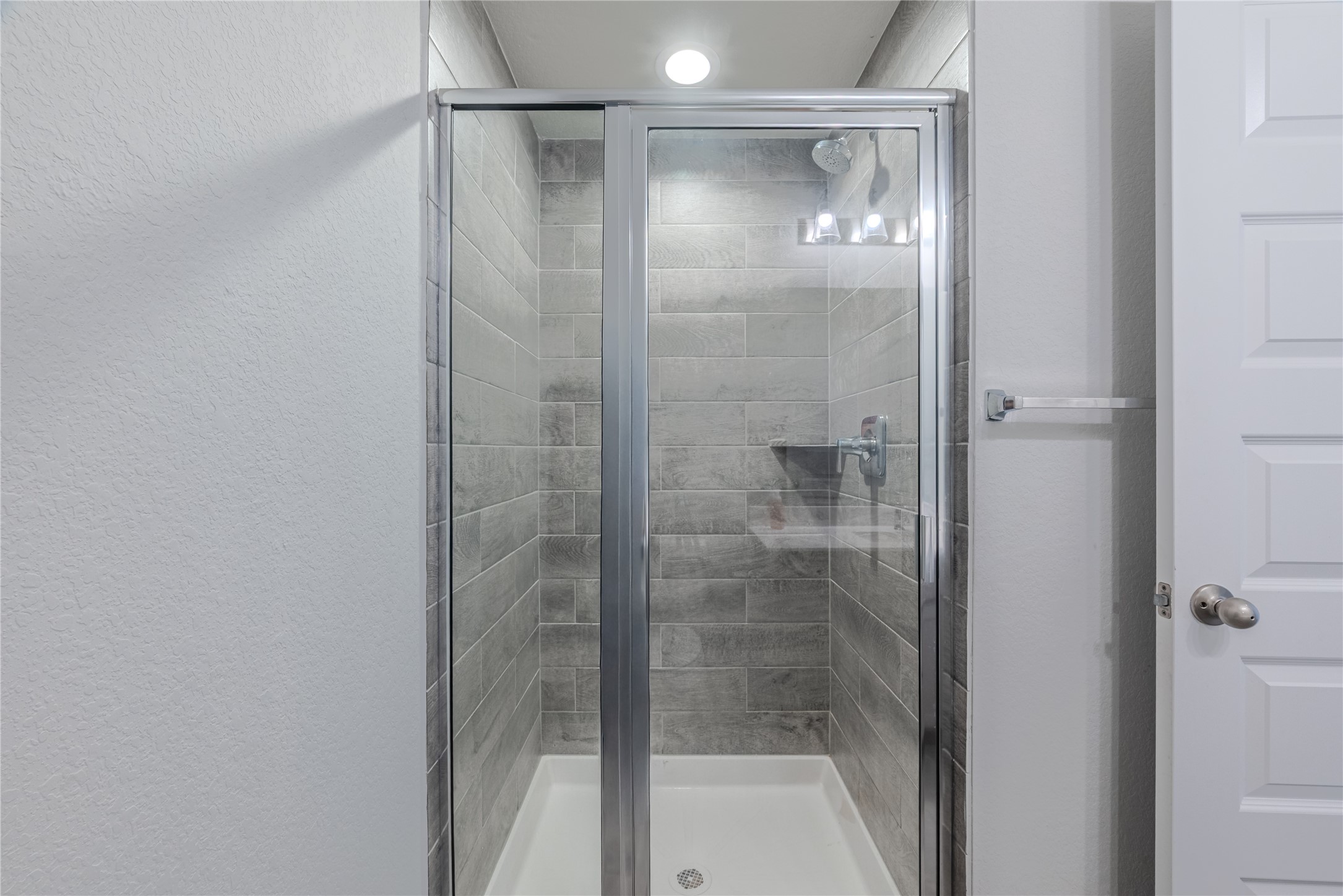 4259 Wyanngate Drive Spring, TX 77373 - Photo 24 of 46 Beautifully appointed downstairs guest bathroom complete with a modern vanity and a glass-enclosed walk-in shower