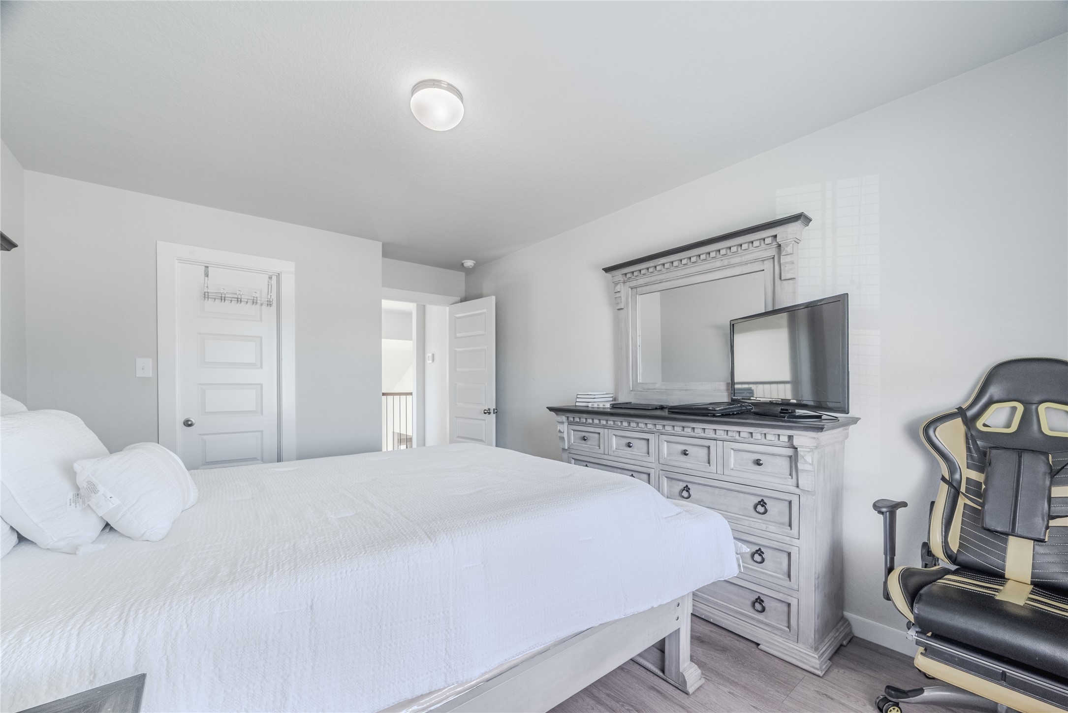 4259 Wyanngate Drive Spring, TX 77373 - Photo 41 of 46 This well-sized bedroom offers a modern aesthetic with sleek flooring and plenty of natural light from the large window.