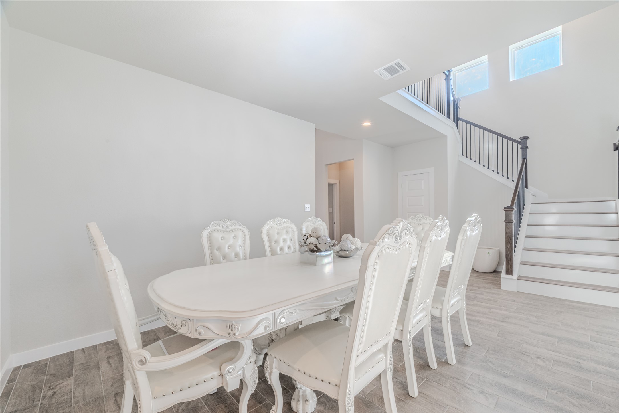 4259 Wyanngate Drive Spring, TX 77373 - Photo 4 of 46 The formal dining room is bathed in natural light, creating an elegant space for entertaining.