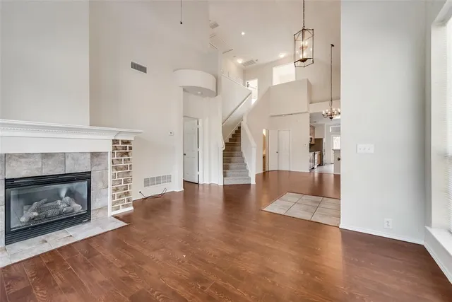 a view of a livingroom with a fireplace and window