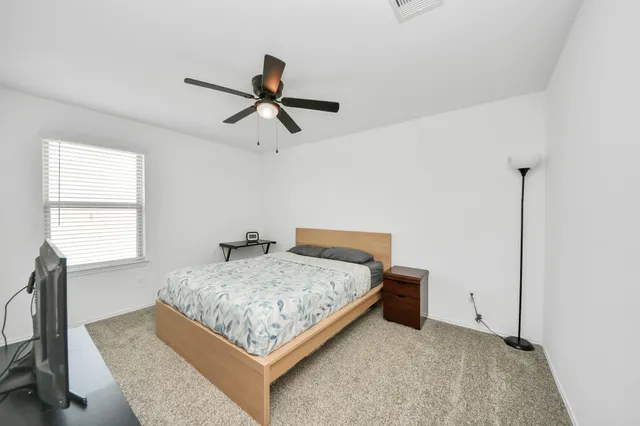 an empty room with windows and stairs