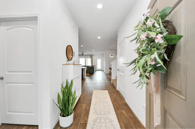 a vase of flowers sitting on a floor