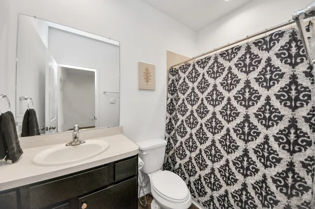 a kitchen with stainless steel appliances granite countertop a lot of counter space and wooden floors