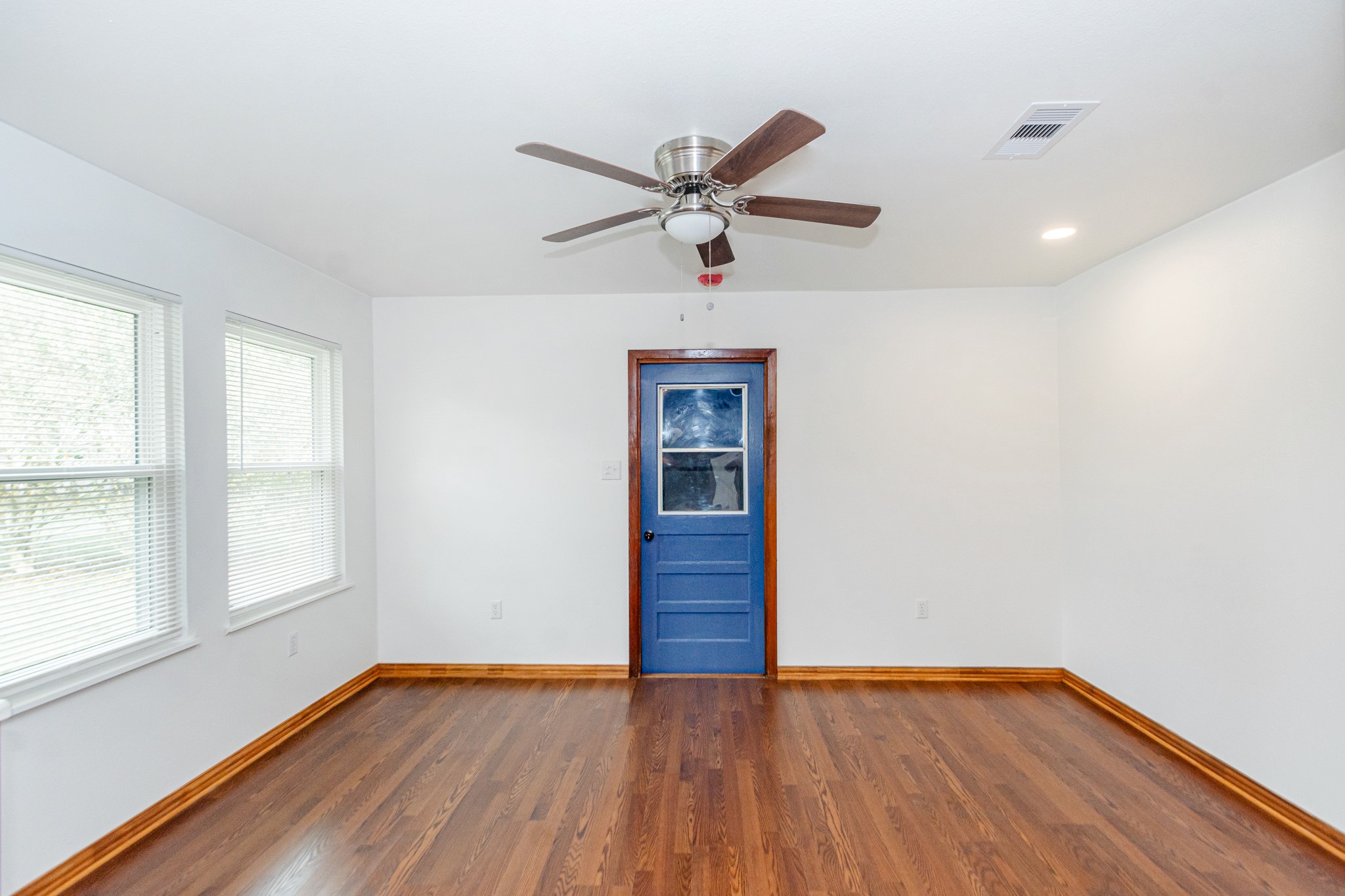 1007 Earley Street Sweeny, TX 77480 - Photo 14 of 33 a view of empty room with wooden floor and fan