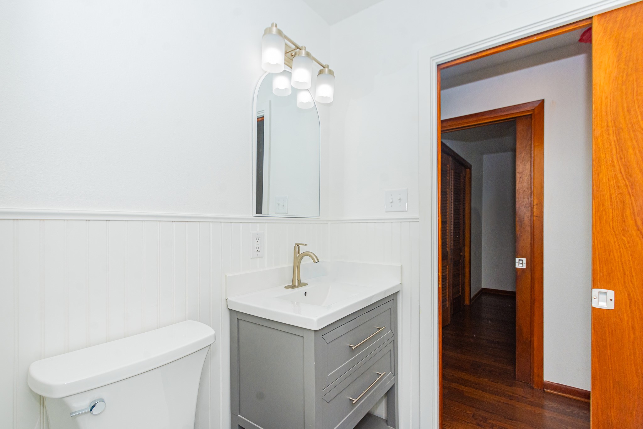 1007 Earley Street Sweeny, TX 77480 - Photo 15 of 33 a bathroom with a toilet sink and mirror
